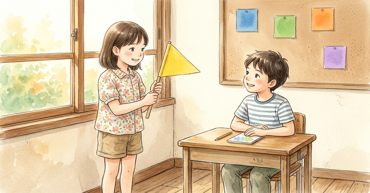 教室で、子どもが手作りの小さな旗を持ち、友だちに説明している。